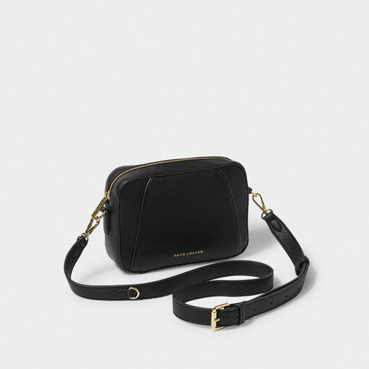 crossbody black handbag with strap against a white background