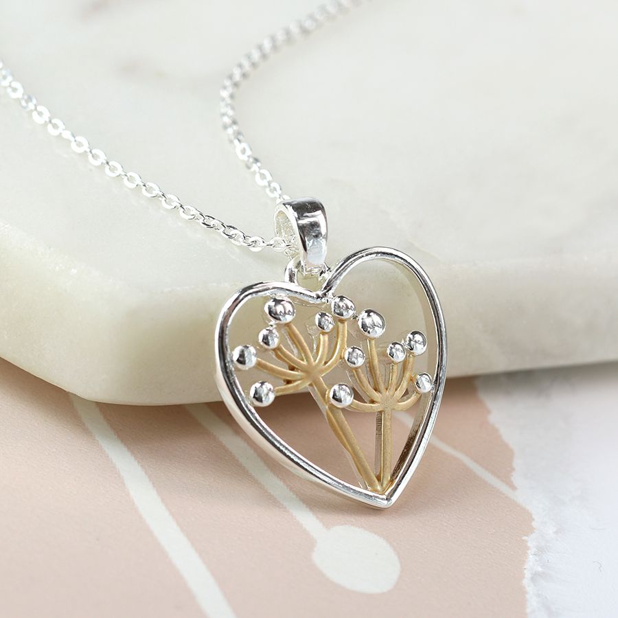 Silver plated heart necklace with golden floral centre
