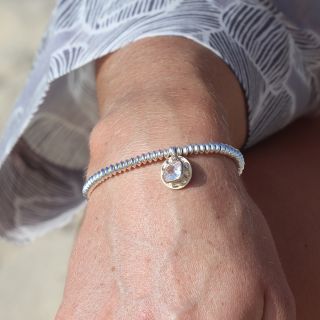 Silver plated bead bracelet with golden disc and crystal