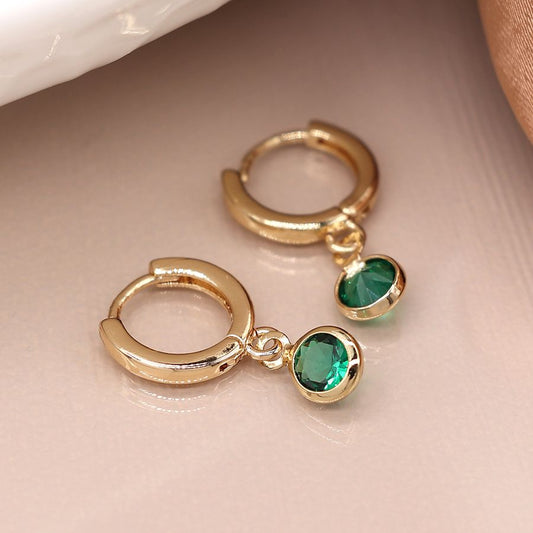 Golden mini hoop earrings with green crystal drops