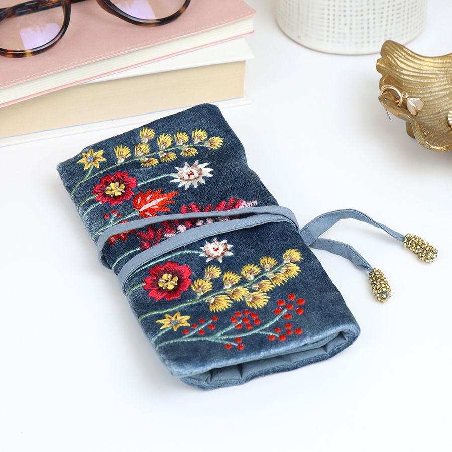 Dusky blue velvet jewellery roll with embroidered wildflowers