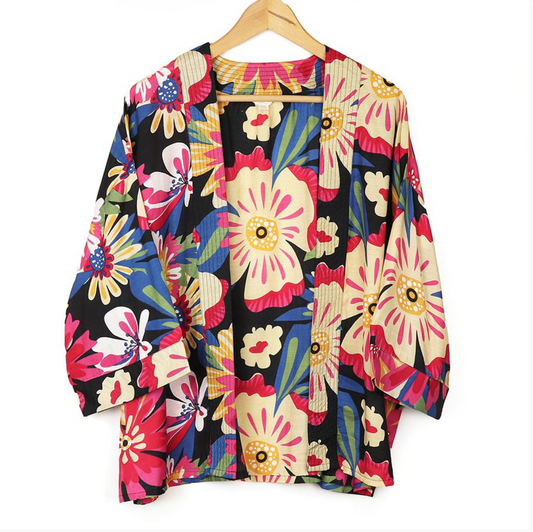 kimono with a vibrant hibiscus floral print in shades of coral and blue.