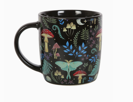 Black mug with a 'mystical forest' print with toadstools, moths, various foliage a star and moon