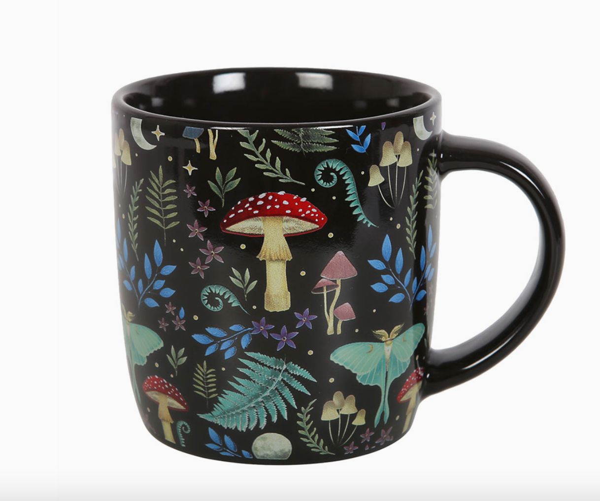Black mug with a 'mystical forest' print with toadstools, moths, various foliage a star and moon