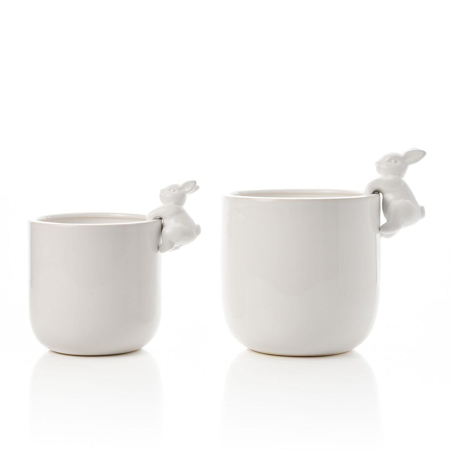 Set of 2 white ceramic planters, one large and one small, each with a small ceramic bunny rabbit hanging from the right hand side.