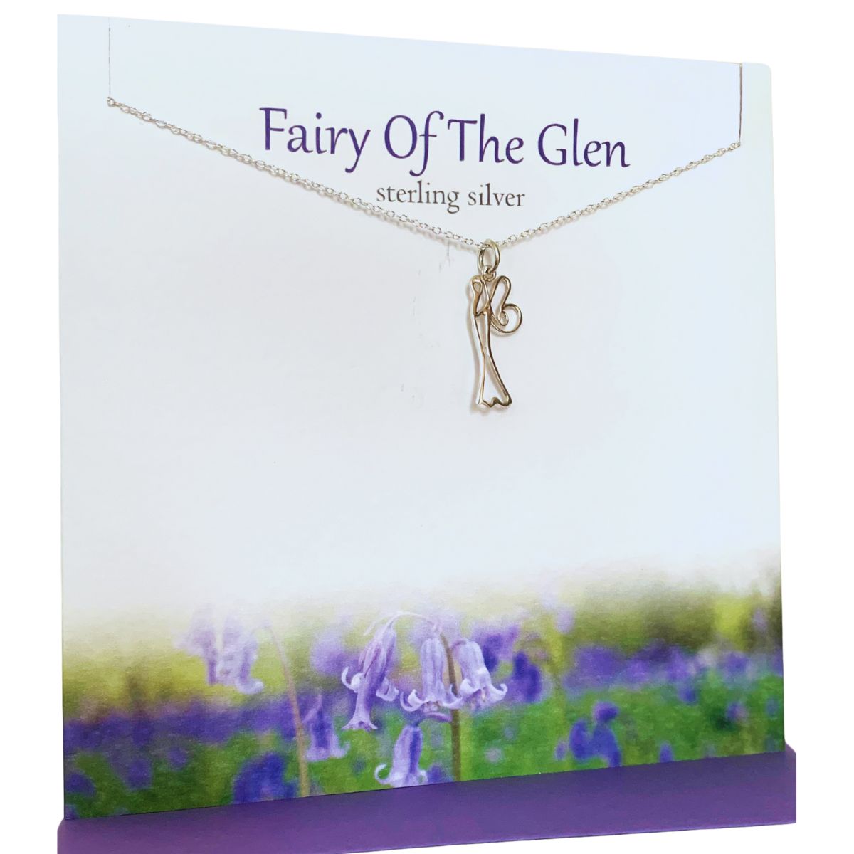 Silver pendant necklace featuring the outline of a fairy presented on a greeting card with bluebells along the bottom edge. The card says 'Fairy Of The Glen' Sterling Silver'