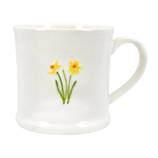 white bone china mug with a motif featuring 2 yellow daffodils with orange centres, green stems ad leaves