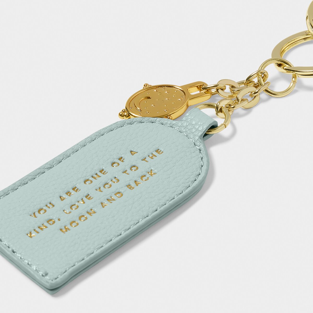 Pale blue keyring with gold charm and gold hardware rings with gold foiled 'Love You To The Moon and Back' sentiment close up picture