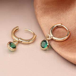 Golden mini hoop earrings with green crystal drops