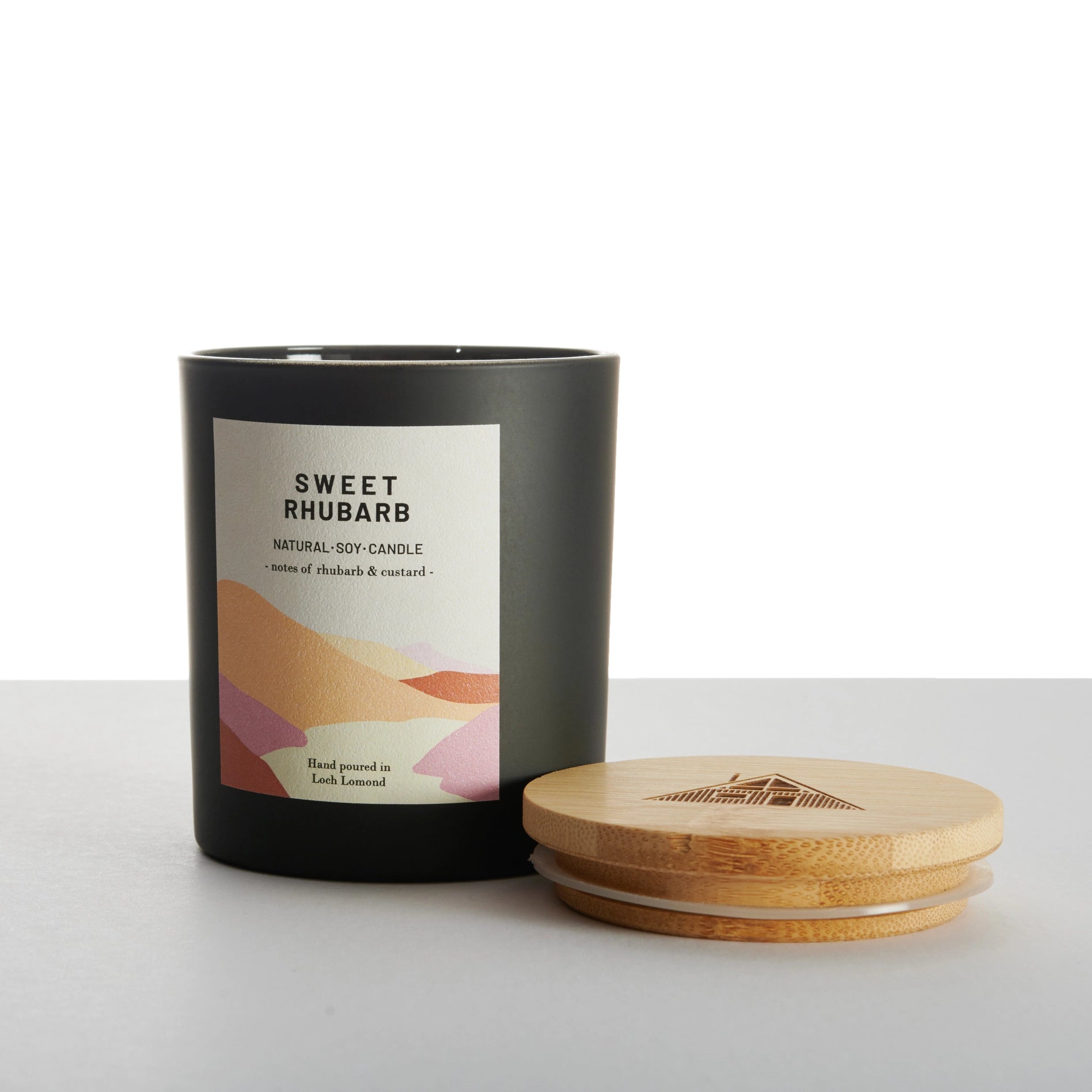 Sweet Rhubarb scented candle against a white background