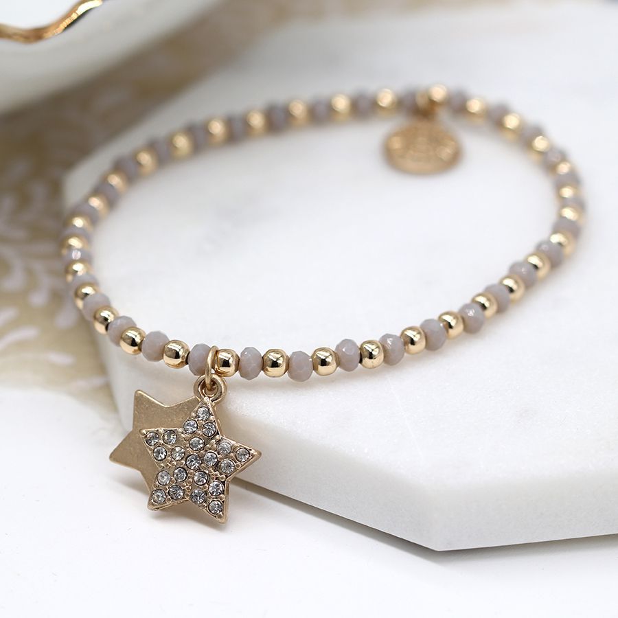 Gold and grey bead bracelet with double star and crystal charms