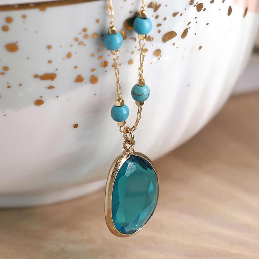 Golden turquoise bead necklace with teal crystal drop