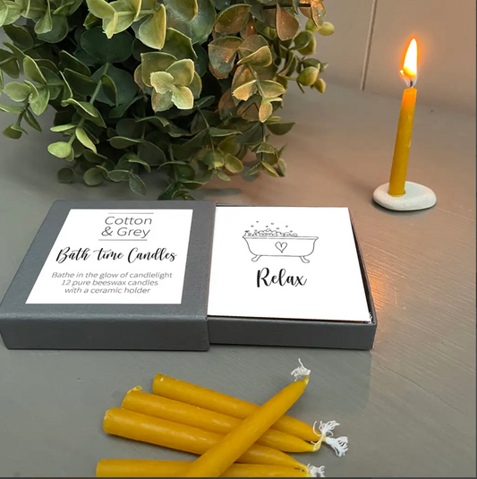 box of twelve beeswax candles with ceramic holder